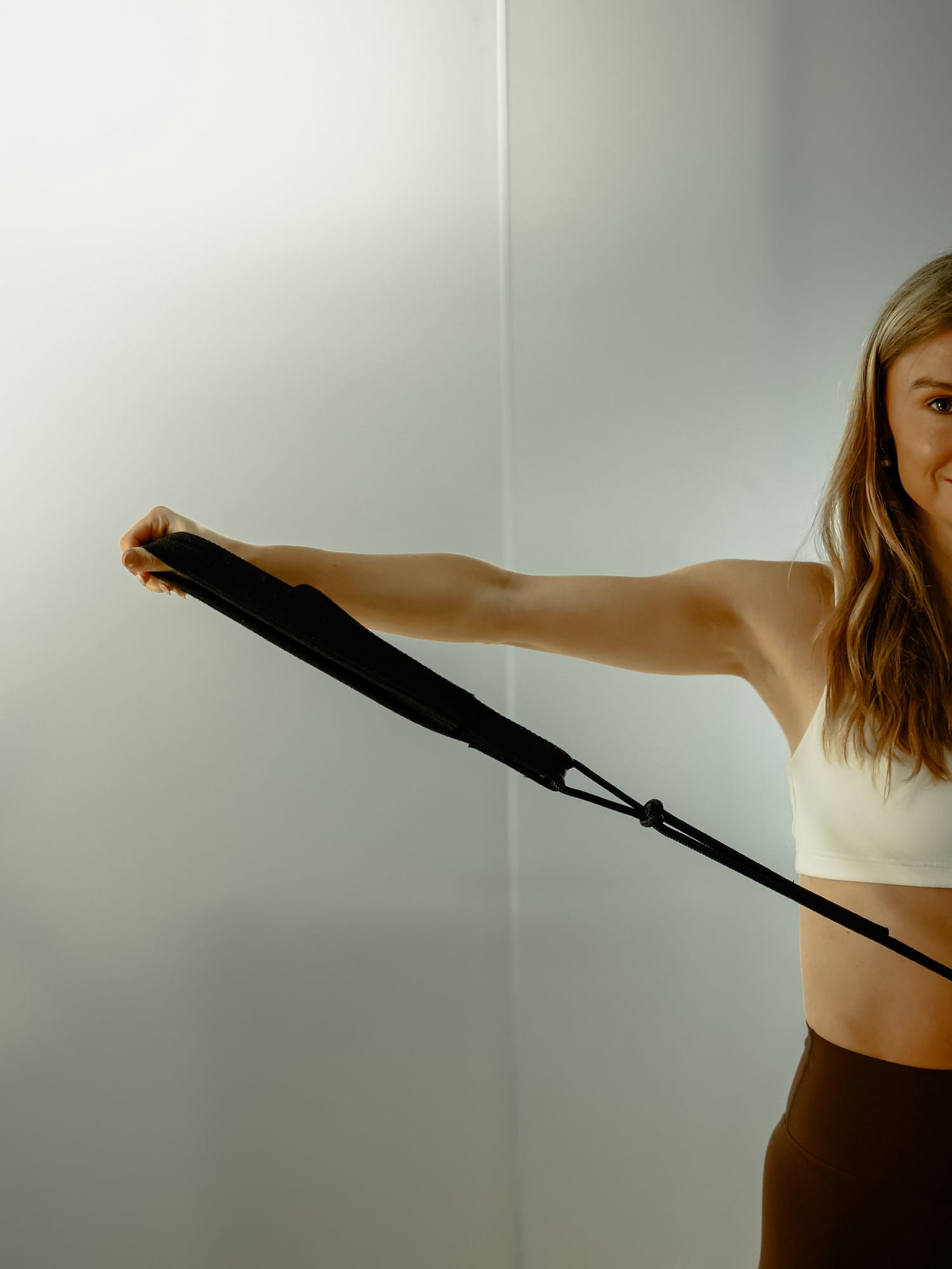 A client performing resistance band work at Kor Pilates, part of The Verbier Touch